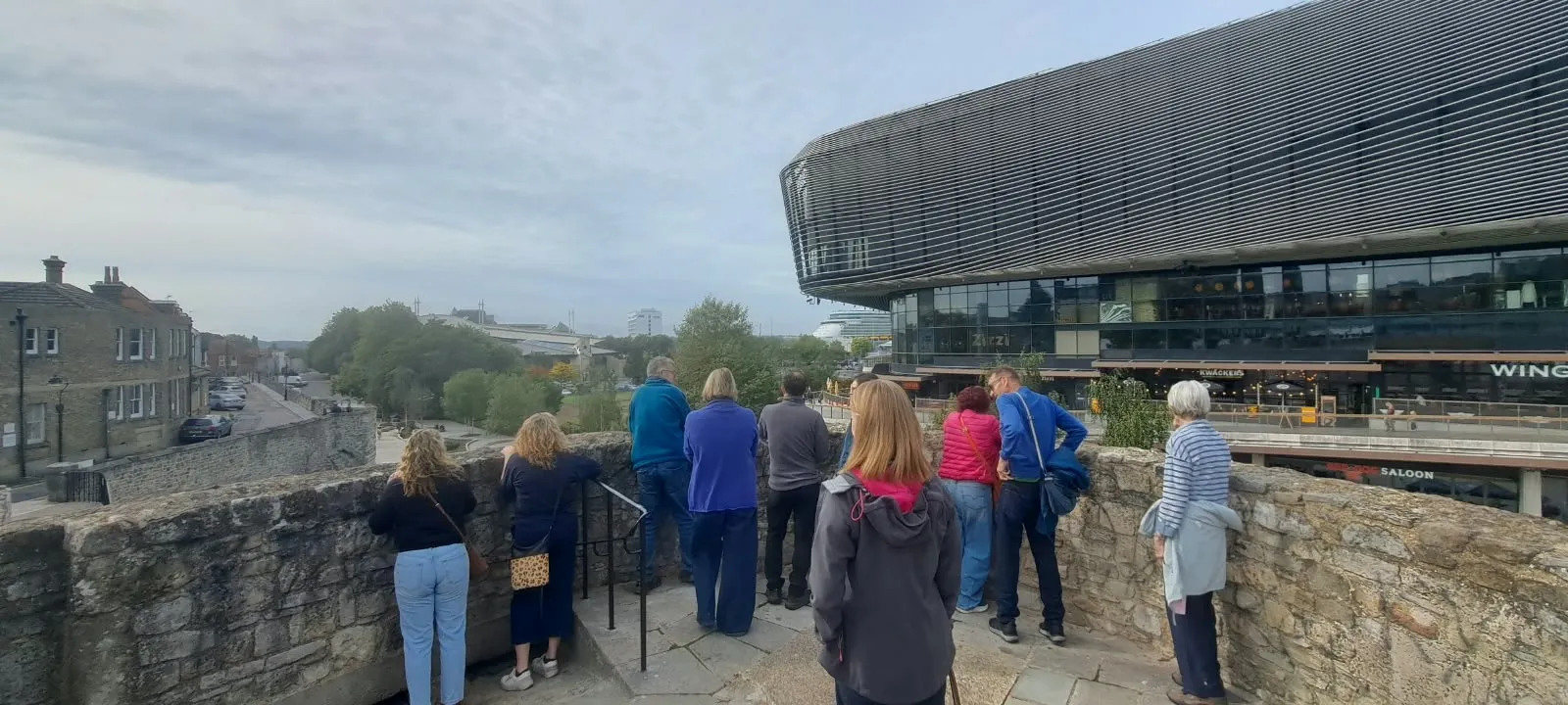 Tour guests looking out from Southampton's medieval walls